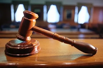 Thirteen Suspects Face Court for Murder